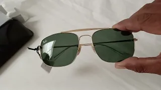 Rayban RB3560 colonel golden frame with dark green lenses.