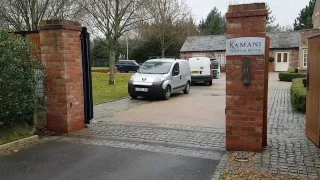 Steel framed electric automated sliding gate with Oak panel infill By TITAN