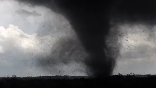 Extremely violent tornado throwing large debris into the air - Lincoln, NE