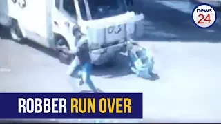 WATCH: Robber run over by cash in transit vehicle