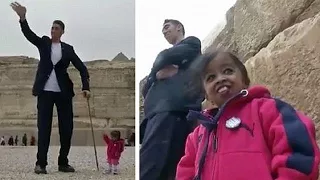 World's tallest man and smallest woman visit Egypt's famous pyramids