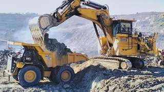 Caterpillar 6030B excavator loading and cat 777 truck lifting power