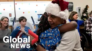 Barack Obama delivers gifts to kids at children's hospital