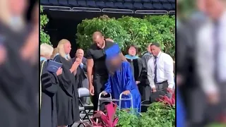 Shooting survivor walks at graduation