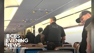Man arrested after threatening passenger mid flight