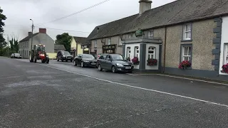 International 674 tractor driving through Kilmainhamwood village