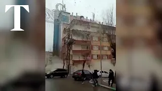 Moment building collapses in Turkey after earthquake