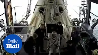 NASA astronauts exit SpaceX Dragon Capsule after a splashdown
