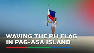 Filipino traveler waves Philippine flag in Pag-asa Island | ABS-CBN News