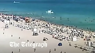 Moment helicopter crashes feet away from swimmers at Miami’s South Beach