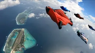 Wingsuit flying over Maldives island