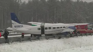 Small plane makes emergency landing on snowy highway