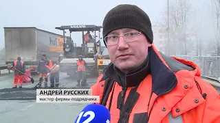 Новый асфальт укладывают сегодня на путепроводной развязке Кирилловского шоссе в Череповце