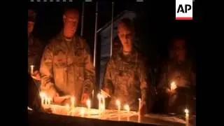 U.S. troops pause for a moment of silence to remember brought America to Afghanistan and to honor th