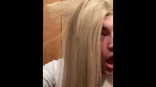Girl flat irons her hair and burns a big chunk completely off.