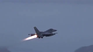 F-16 Fighting Falcon fighter jet taking-off burner flames