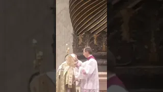 Mons Guido Marini corrects the hair, zucchetto and mitre of Pope Benedict XVI