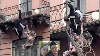 Moment fighting couple fall 25ft from balcony and survive death defying plunge