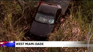 Pickup truck ends up in a canal after a crash in west Miami-Dade.