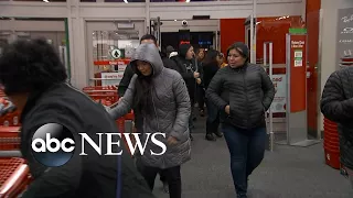 Shoppers wait in lines for Black Friday deals