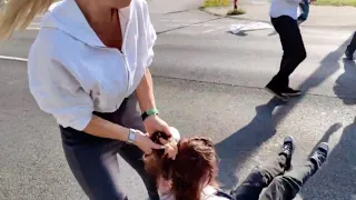 Brutal blonde’ drags climate activist by the hair to stop her from blocking traffic