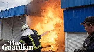 Firefighters rush to the site of a Russian missile strike in Sloviansk