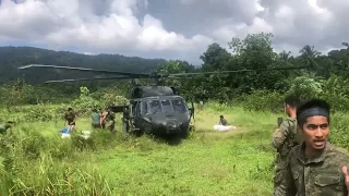 Strong wind blows Black Hawk Helicopter delivering supply to Philippine Army.