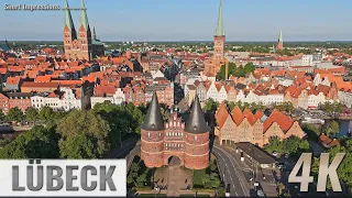 Lübeck, Germany: Holstentorplatz, Holstentor, Salzspeicher, Altstadt - Im Abendlicht - 4K UHD - 0237