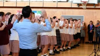 PM Ardern visits Christchurch school as first funerals begin