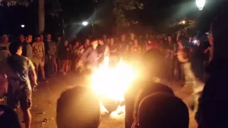 Two guys fall into a camp fire during a game