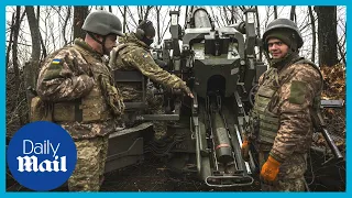 Ukrainian troops fire rounds from a French TRF-1 howitzer