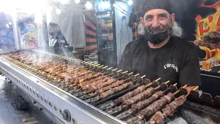Italy Street Food Fair. Small Sticks of Sheep Meat Roasted on Charcoal. "Arrosticini"