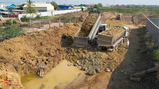 Smooth​ing Working Heavy Trucks Komatsu Dozer Push Rock Filling In Water For Making Foundation Road