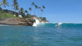 Surfing Hawaiian cliff side