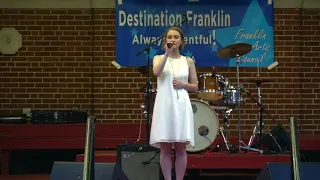 Joni Zacherl singing "Go the Distance"