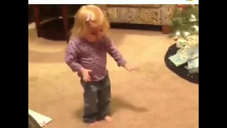 Adorable Little Girl Learning to Dance Cha Cha