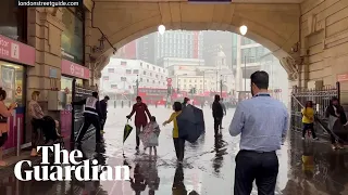 Soaked stations and submerged cars: storms flood parts of London