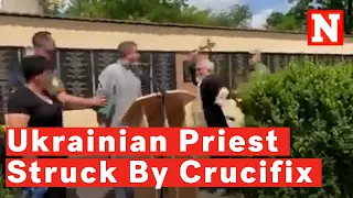 Russian Priest Strikes Ukrainian Priest With Crucifix At Soldier's Funeral