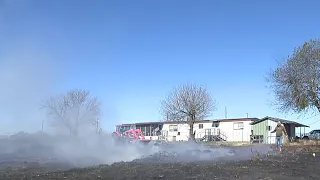 Grass fire burns acres of family's land on East Side