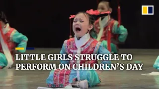 Little girls struggle to perform on China’s Children’s Day