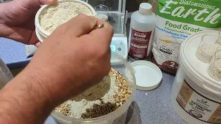 Showing how to mix diatomaceous earth with chicken feed