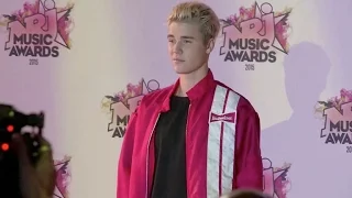 Justin Bieber Looks bored on the red carpet of the NRJ Music Awards 2015 in Cannes.