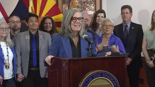 Arizona's Democratic governor signs a bill to repeal 1864 ban on most abortions