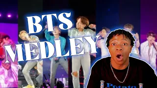THEY'RE NOT REAL PEOPLE FOR THIS!! Rapper reacts to BTS Medley | REACTION w @GetFitUnivercity