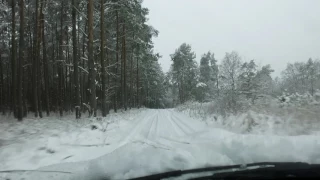 BMW  X3 on snowy track in beautiful landscape