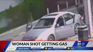 Surveillance video shows woman get carjacked and shot at Indy gas station