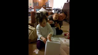 Betty opening her bear puppet from Aunt Suzy and Aunt Pat