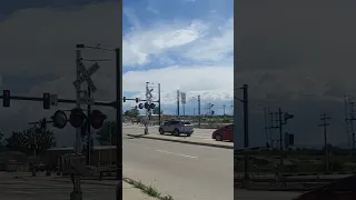 Dumb driver almost breaks railroad crossing gate!