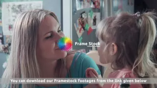 Mother and girl eating cheese then hugging and kissing stock footage