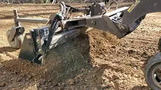 Toro dingo tx420 using a soil conditioner  Harley rake